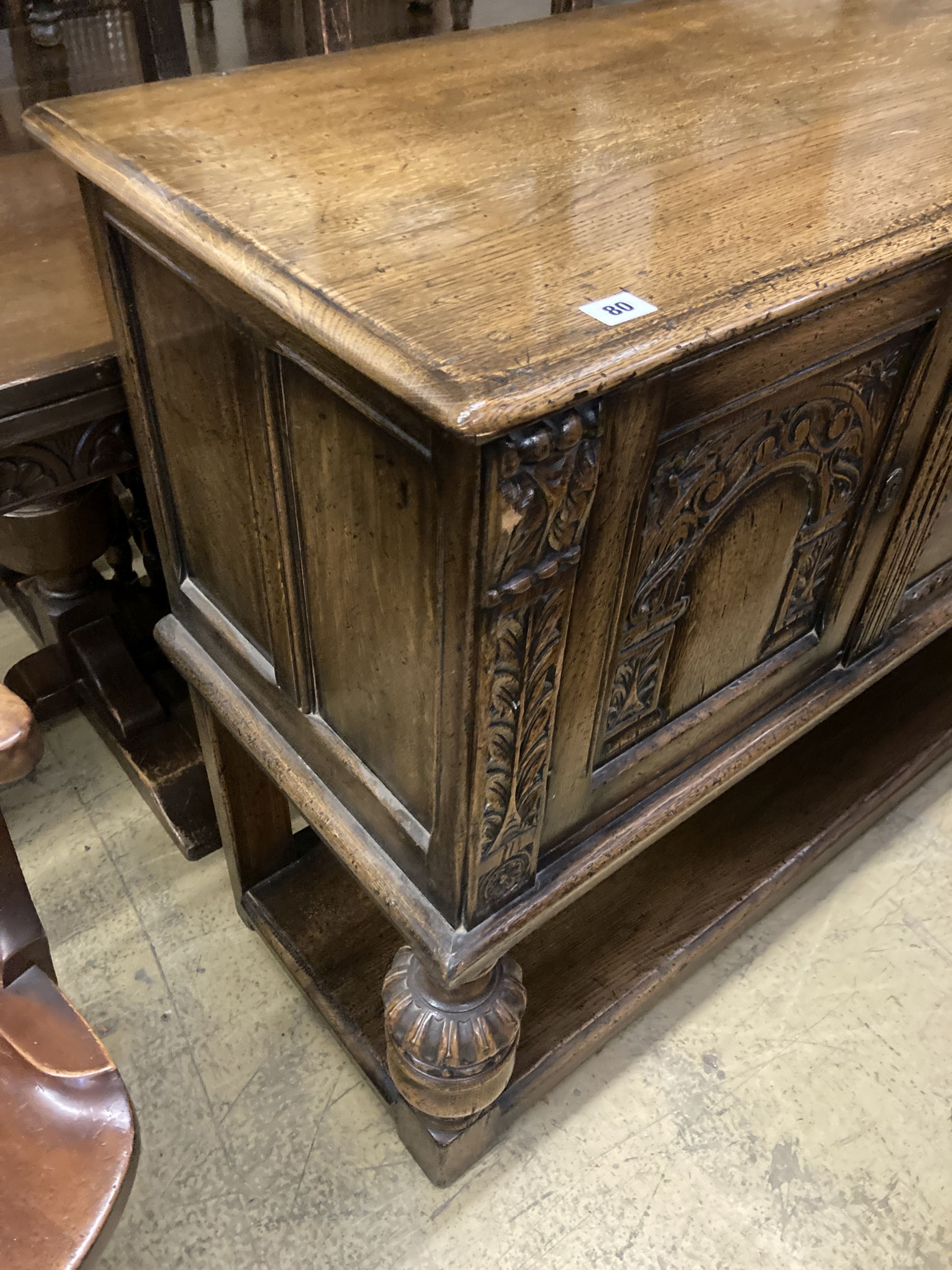 An 18th century style oak sideboard, length 150cm, depth 46cm, height 93cm